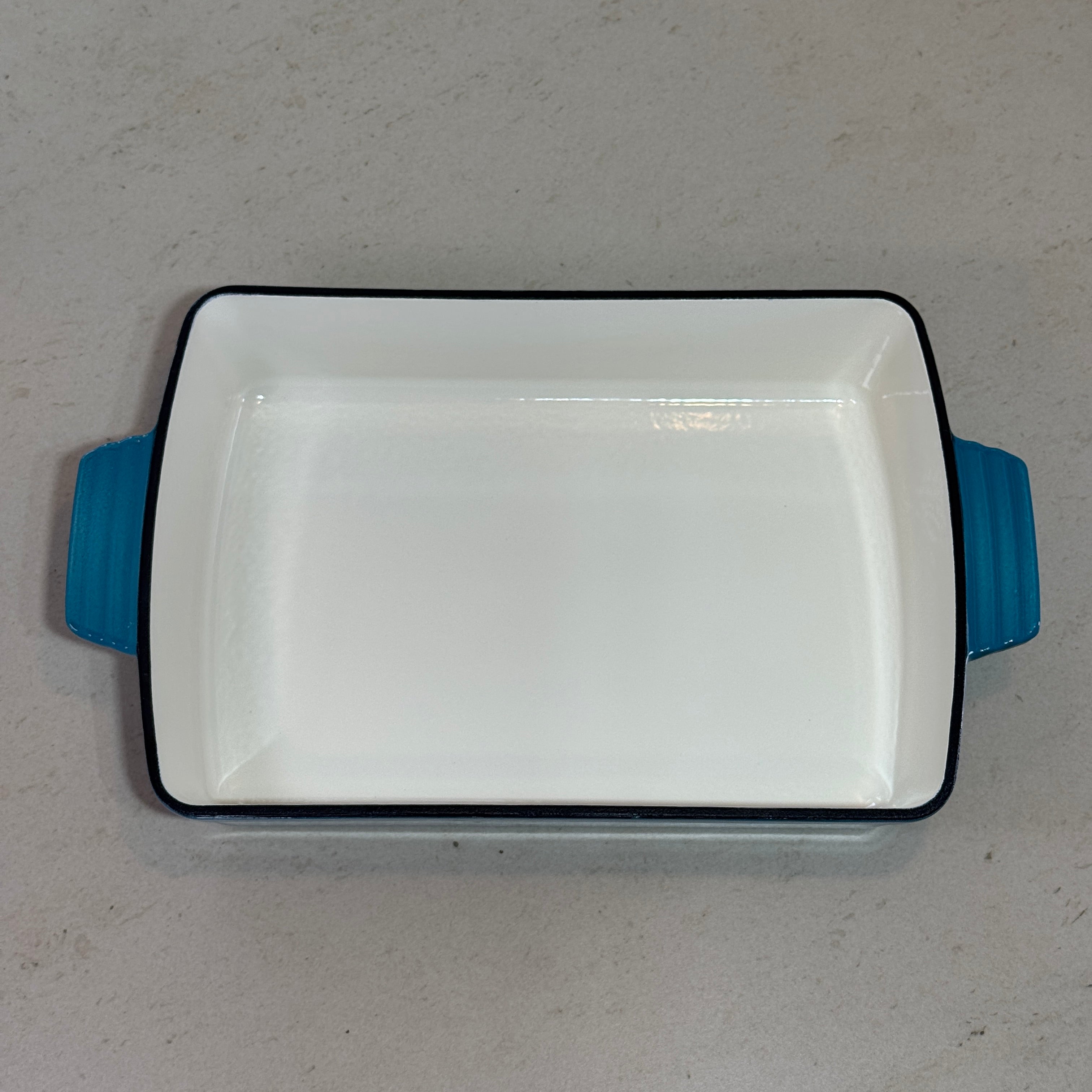 Intérieur plat à rôtir en fonte émaillée bleu turquoise